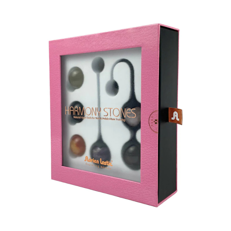 Set of kegel balls for pelvic floor training in a pink gift box with clear window display.