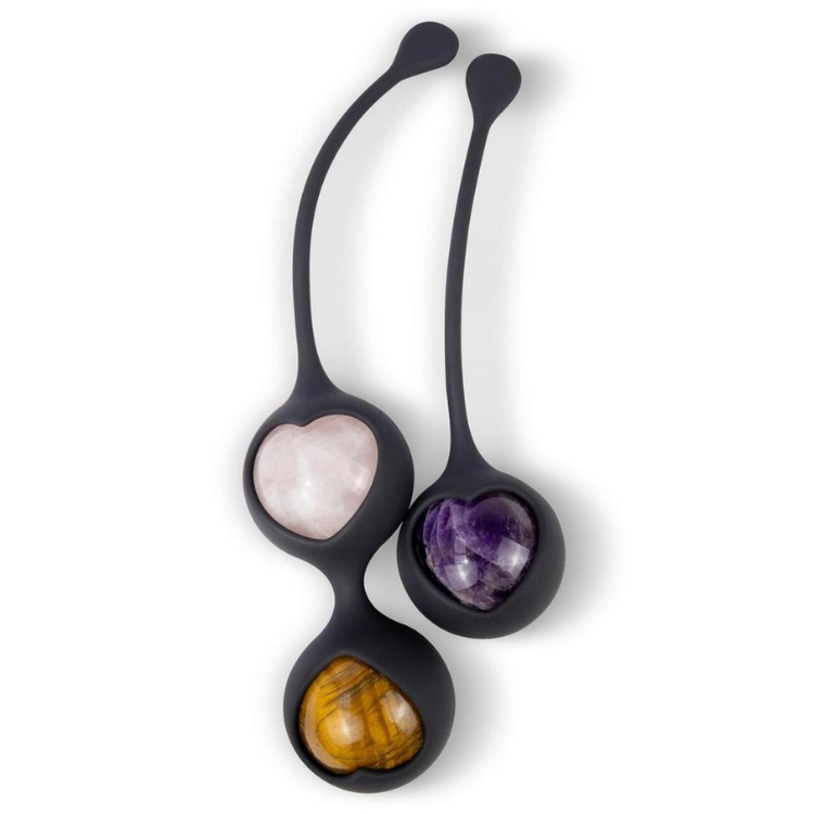 Heart-shaped crystal kegel balls with black silicone holders and retrieval loops