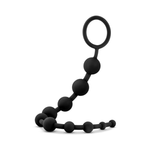 Black silicone anal beads with graduated sizes and ring handle on white background