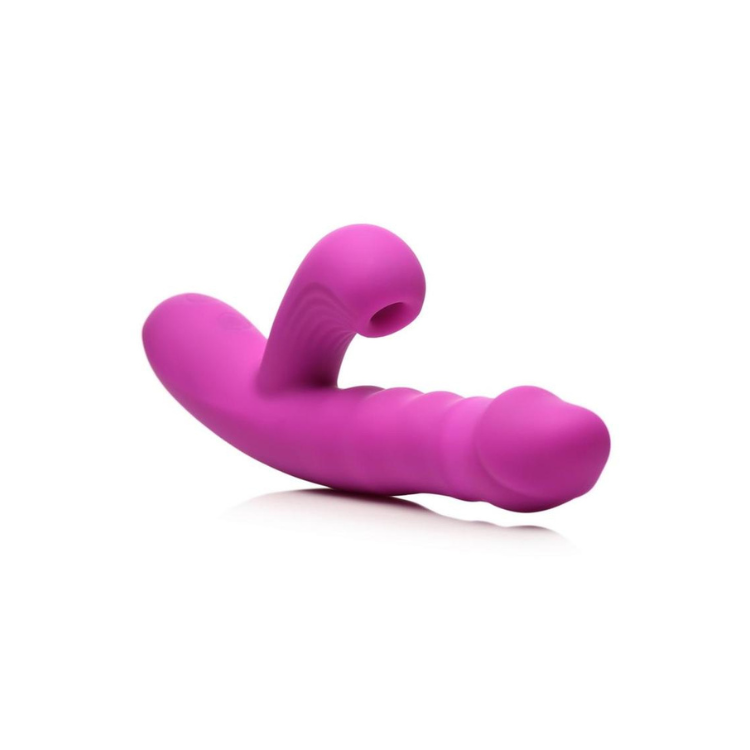 Purple silicone dual-action wellness massager with curved and ribbed design on a white background