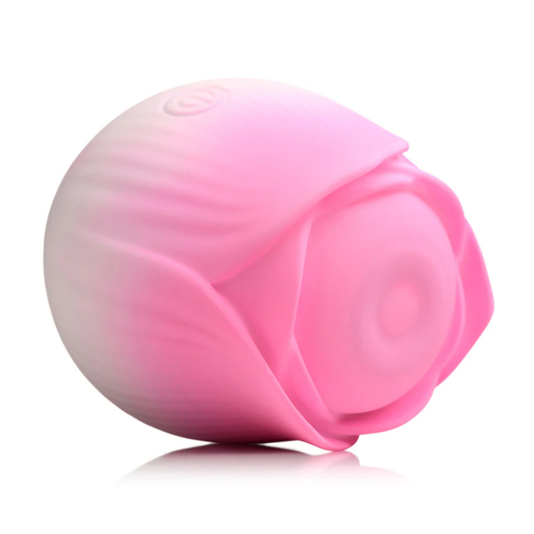Pink rose-shaped silicone wellness device on white background, House of Vices premium toy