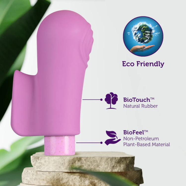 Purple eco-friendly bullet vibrator with sleeve on stone, labeled natural rubber and plant-based material.