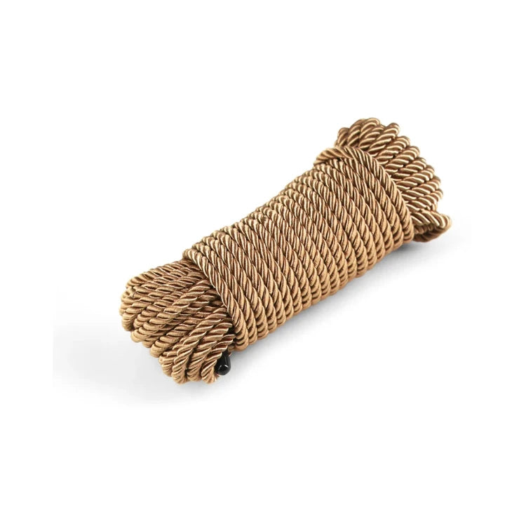 A coil of brown braided rope for bondage and shibari.