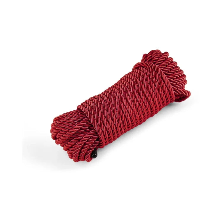 A coil of premium red braided shibari rope for bondage and sensory play.