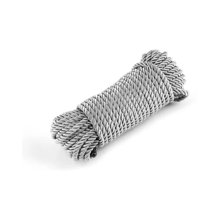 A coil of silver-grey braided rope for sensory play and bondage.