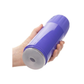 Purple handheld adult toy with silicone opening, held in hand against white background