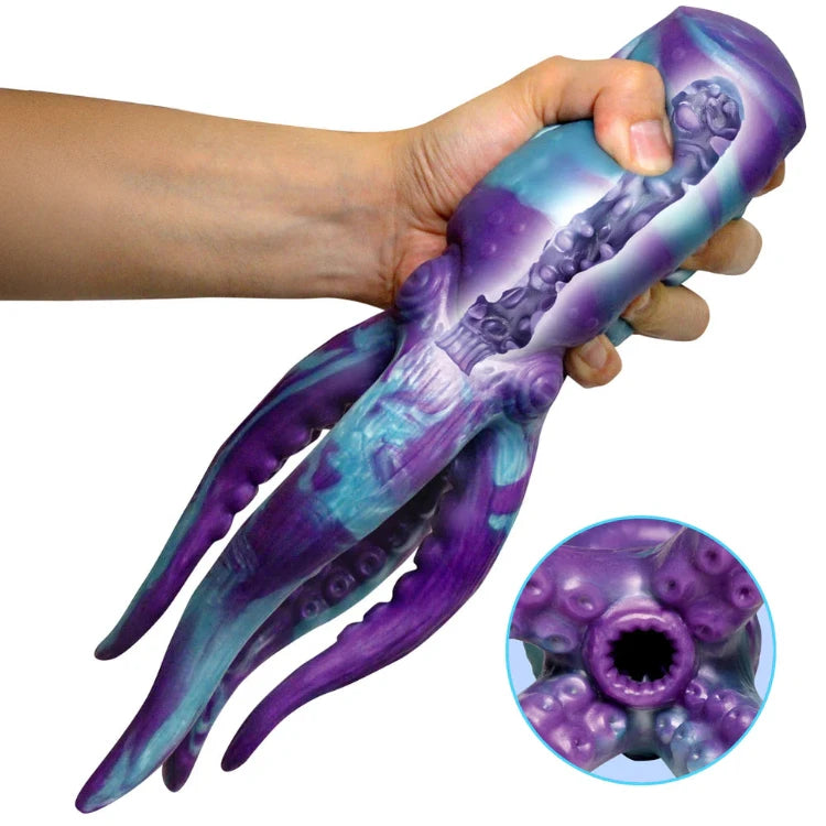 Hand holding a purple and blue silicone tentacle toy with textured details, close-up view