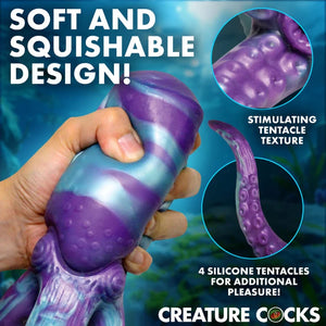 Purple and blue silicone tentacle toy with soft, squishable texture held in hand.