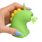 A hand holding the green XR Brands Creature Cuties Lickyhorn licking stimulator toy.