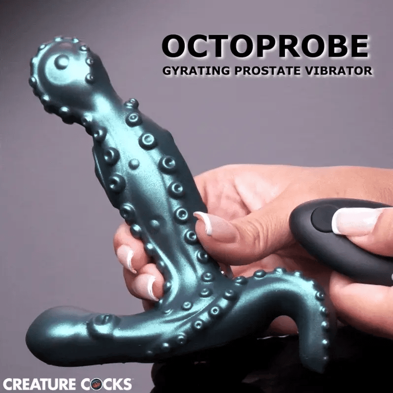 Metallic teal gyrating prostate massager with textured tentacle design, held by hand with remote control