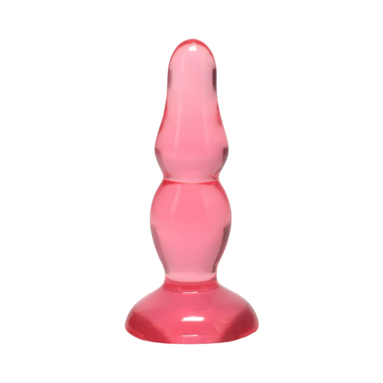 Pink translucent glass anal plug with a rounded tip and flared base