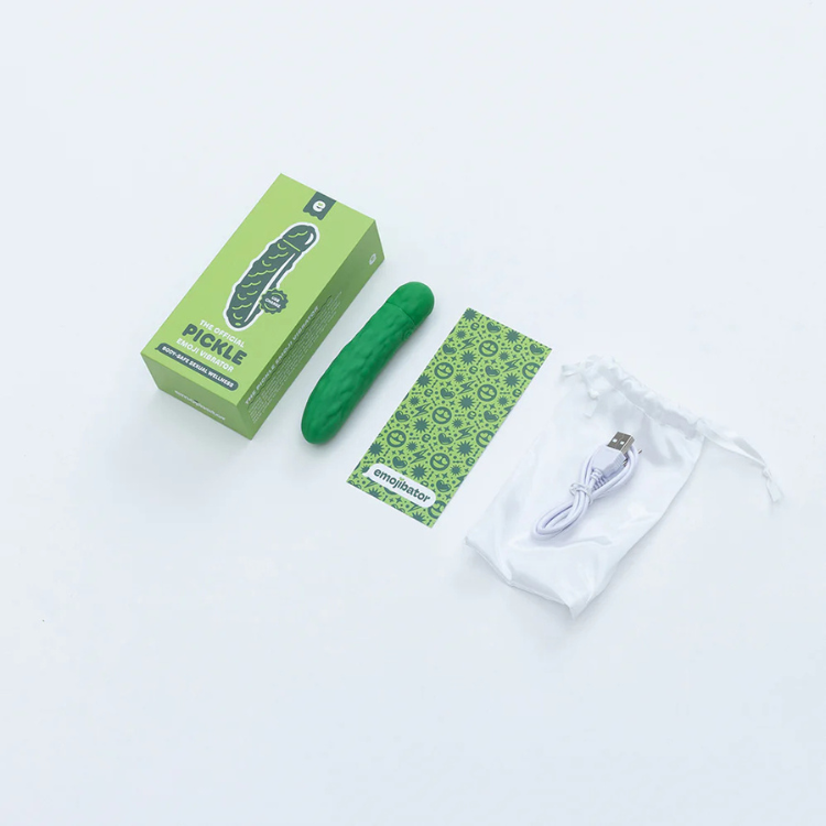 Emojibator Pickle vibrator kit with green box, USB charger, pouch, and instruction card on white background.