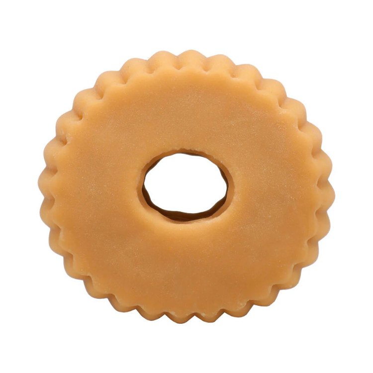 round beige chewy dog dental chew with scalloped edges and center hole