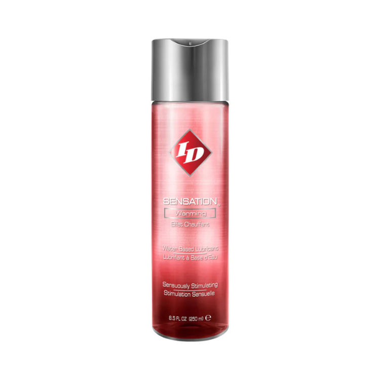 Red bottle of water-based warming lubricant with silver cap, clear label and text