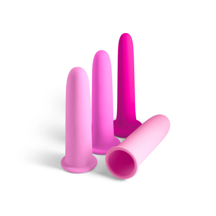 Set of four pink silicone dilators in varying sizes on a white background