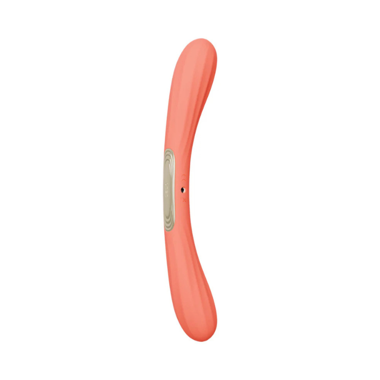 Curved coral silicone personal massager with central control panel, isolated on white background