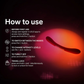 Curved silicone adult toy with backlit glow and usage instructions in a dark setting