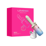 App-controlled vibrating and heating personal massager with suction base, next to pink box