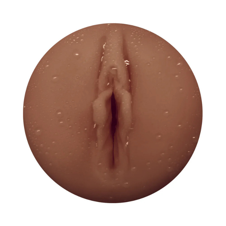 Realistic textured male pleasure sleeve with lifelike vaginal orifice, close-up view