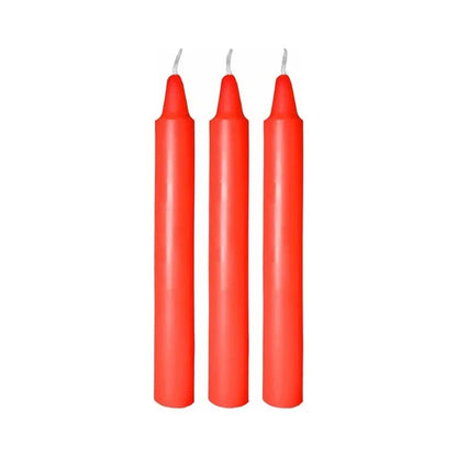 Three tall red taper candles with white wicks on a white background.