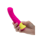 Hand holding pink and yellow quilted silicone rechargeable vibrator