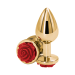 Gold metal plug with red rose detail on base, sexual wellness accessory on white background