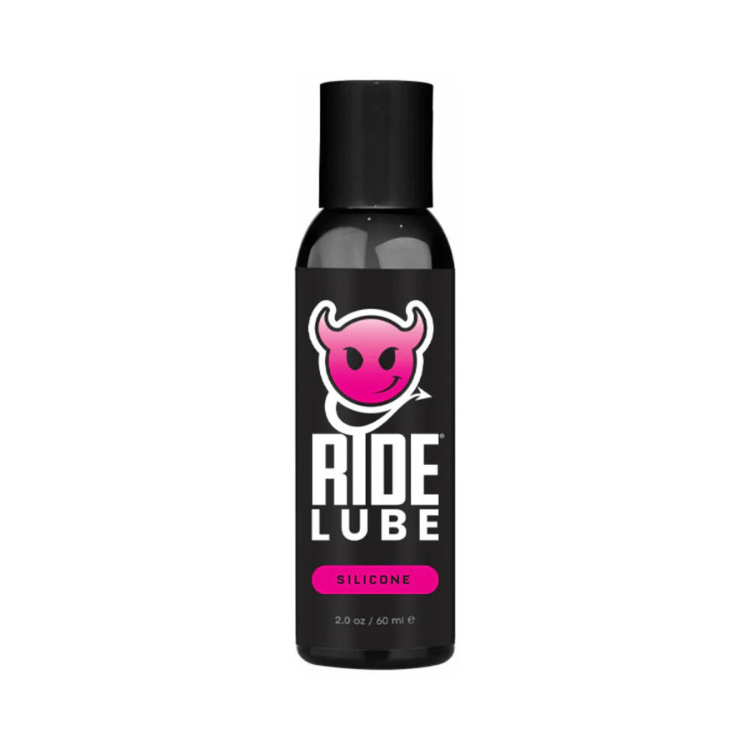 Black 2 oz bottle of Ride silicone lubricant with pink devil logo and white text on label