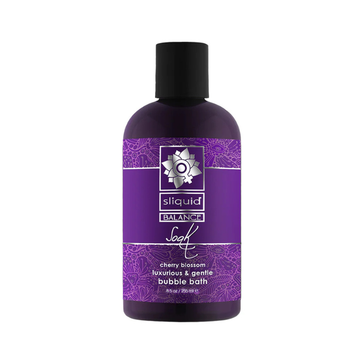 Purple bottle of cherry blossom gentle bubble bath, 8.5 oz, with floral design label.