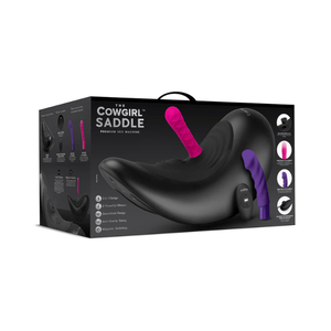The Cowgirl Saddle premium riding machine in black with interchangeable pink and purple attachments, in retail packaging.