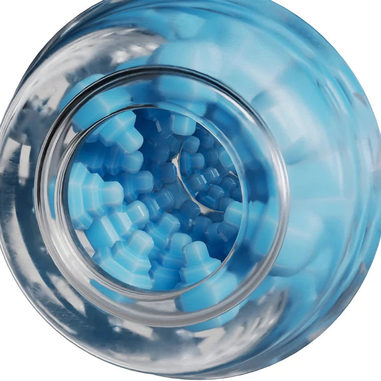 Blue textured massage beads in clear glass jar for intimate wellness