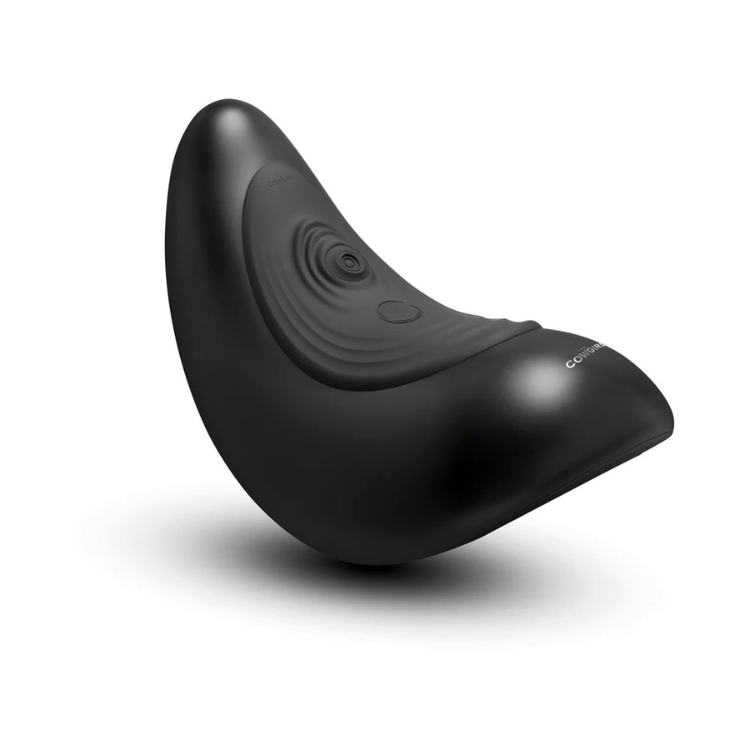 Black saddle-shaped adult toy with curved design and textured surface, isolated on white