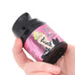 A person holding a Tickle Her clitoral pleasure lubricant bottle.