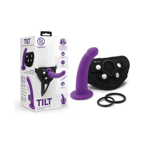 TILT purple vibrating silicone dildo and harness set with O-rings in original packaging
