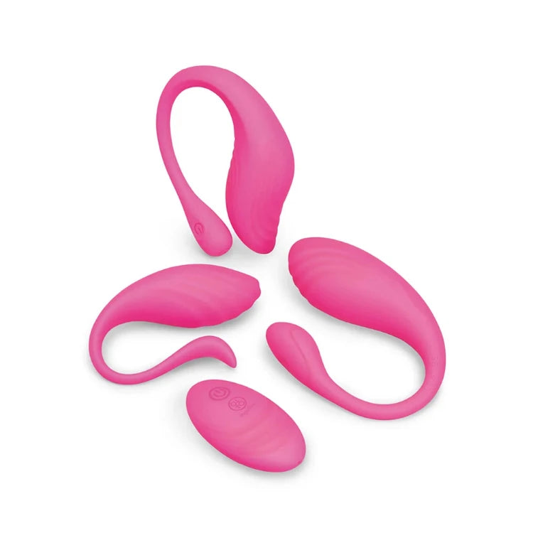 Three bright pink silicone massage toys of various shapes on a white background