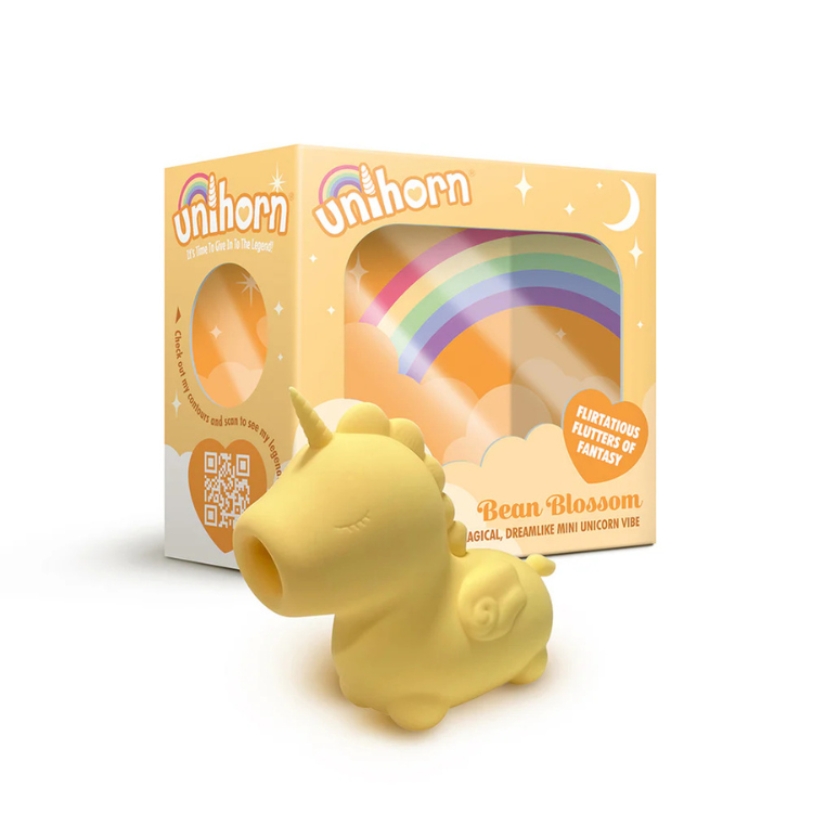 Yellow unicorn-shaped mini vibrator with rainbow-themed packaging labeled 'Bean Blossom'.