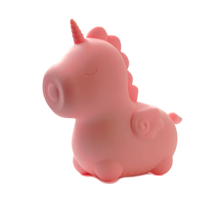 Pink unicorn-shaped pulsing silicone vibrator on white background