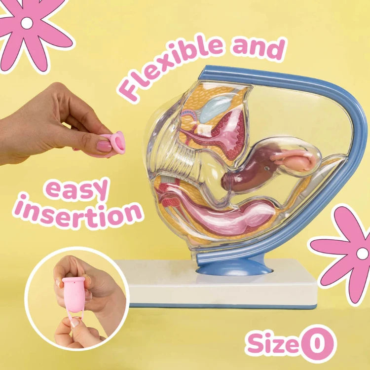 Menstrual cup size 0 shown near a female anatomy model, highlighting flexible, easy insertion.
