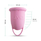 Pink menstrual cup with finger loop, 5.5 cm tall, 3.5 cm wide, 15 ml capacity, UVQ label visible.