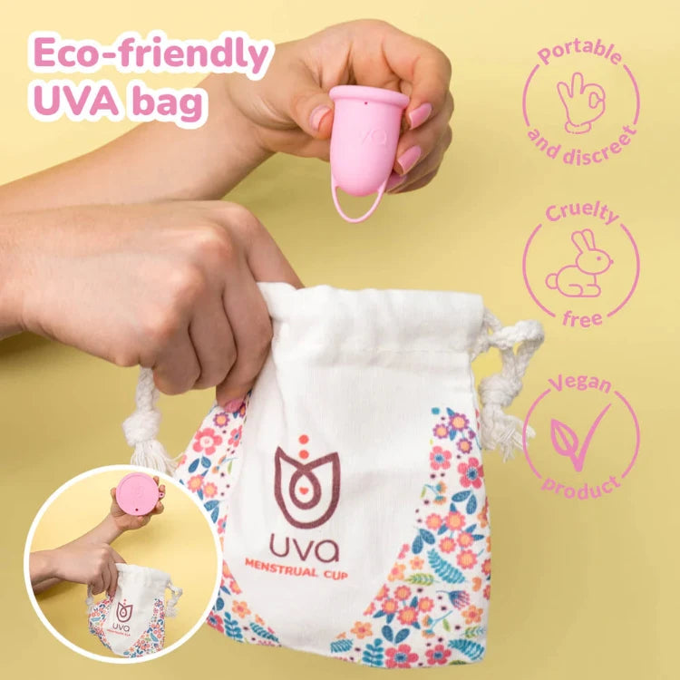 Pink menstrual cup with floral storage pouch, eco-friendly, cruelty-free, vegan, portable.