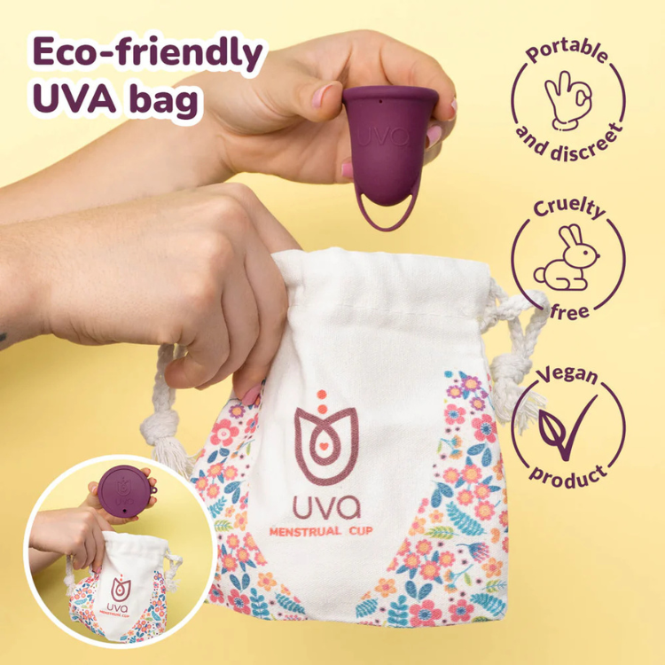 Reusable purple menstrual cup with eco-friendly floral storage pouch, cruelty-free and vegan