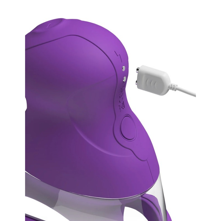 Purple rechargeable wellness device with a white USB charging cable plugged in.
