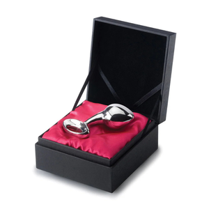 Stainless steel weighted plug in a black gift box with red satin lining, luxury adult toy